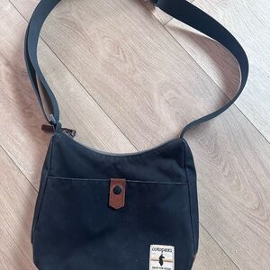 Cotopaxi Black Canvas Perla Bag